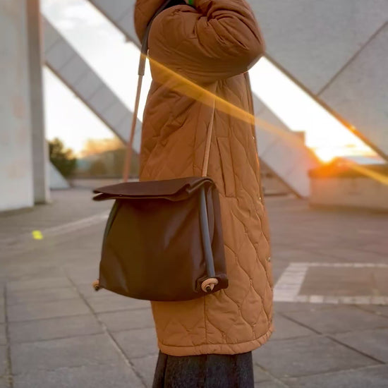 brown faux nubuck pleather convertible bag going from shoulder to back