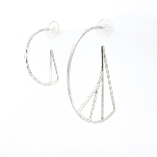 Silver hoop earrings with vertical bars on a white background