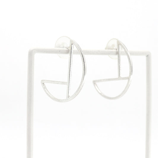Silver hoop earrings on a white background