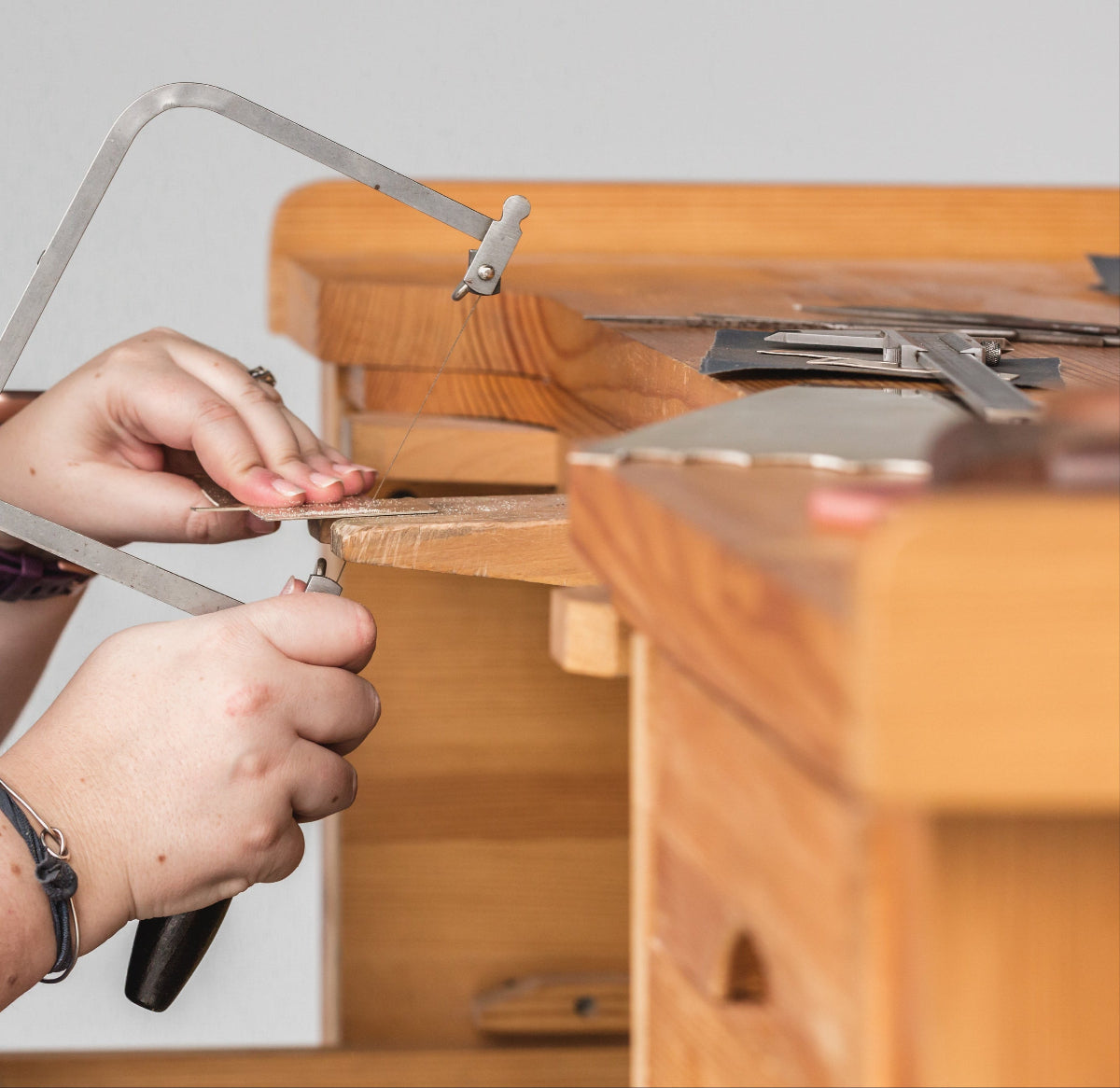 hand sawing silver 